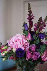 beautiful floral background of modern beautiful flowers in purple and pink. spray roses, hydrangea, and other beautiful flowers in a bouquet