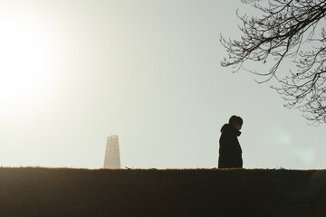Fototapeta premium silhouette of a person in a park