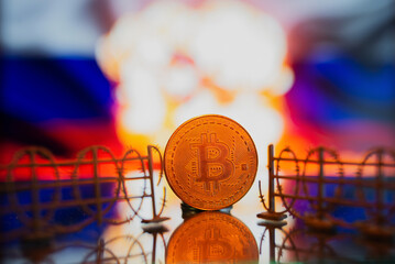 Barbed wire on the background of the Russian flag with bitcoin. The concept of sanctions and...