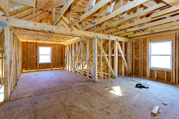Fototapeta na wymiar New stick built building view framing of beams on new home under construction