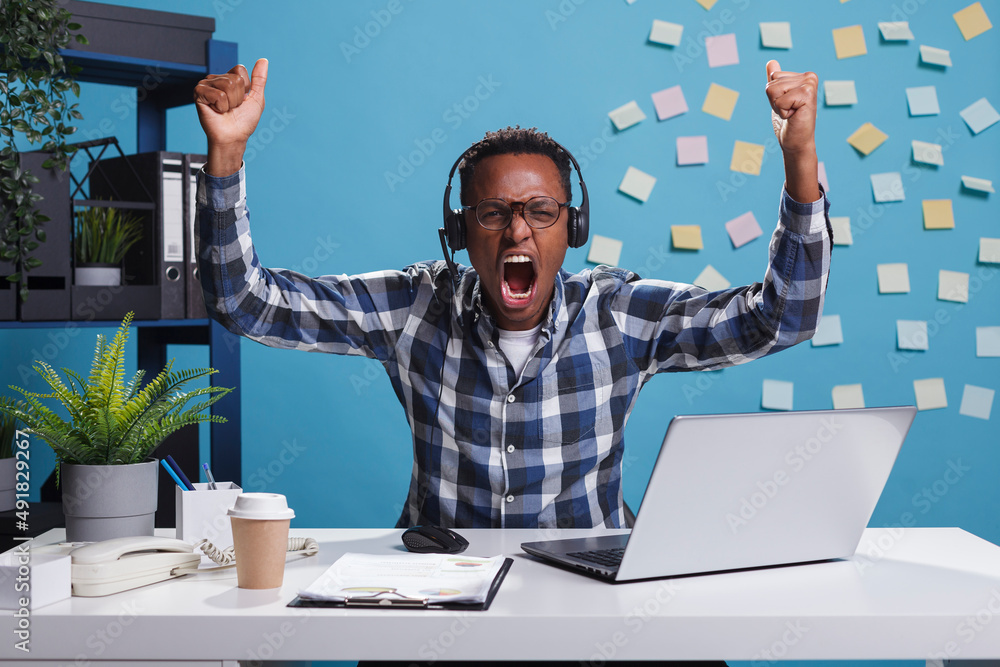 Poster customer support operator celebrating successful day at work by clenching fists in triumph. helpline