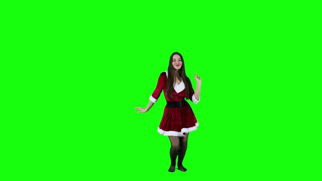 Attractive female dancer dancing in front of the green screen