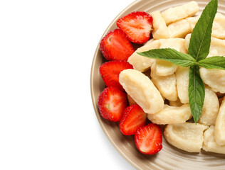 Plate with tasty lazy dumplings and strawberry on white background, closeup