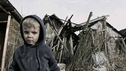 Child playing war in ruins 