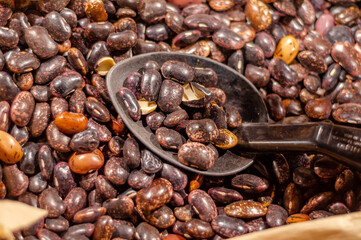 Colored beans with spoon for set. Sale of beans in supermarket.