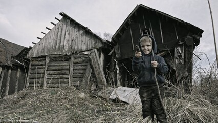 Child playing war in ruins 