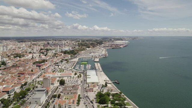 Aerial pan shows port city of Setubal in Portugal; Doca do Comêrcio