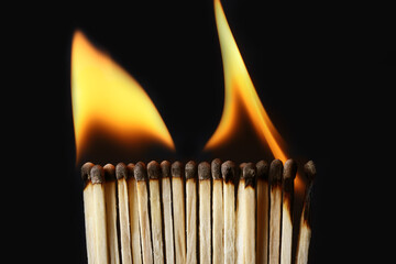 Line of burning matches on black background. Inspiration concept
