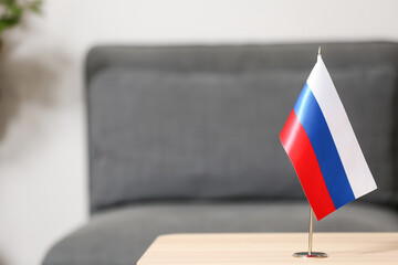 Russian flag on table in light room