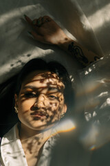 Portrait of a beautiful girl with Cuban roots in stylish clothes and sunshine