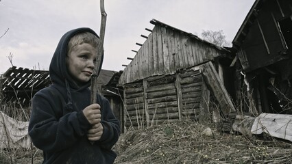 Child playing war in ruins