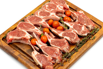 Lamb chops isolated on a white background. Raw lamb chops on wood serving board