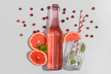 Composition with bottle of fresh soda on grey background