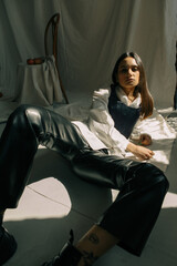 Portrait of a beautiful girl with Cuban roots in stylish clothes and sunshine