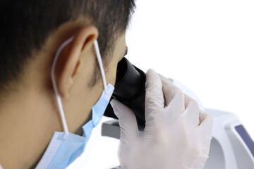 Close up Scientist researcher using microscope in a laboratory
