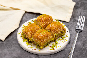 Pistachio baklava. Close-up. Traditional Middle Eastern Flavors. Traditional Turkish baklava. local name fistikli baklava
