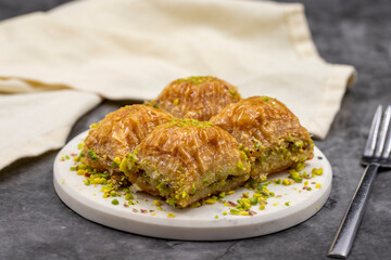Pistachio baklava. Close-up. Traditional Middle Eastern Flavors. Traditional Turkish baklava. local name fistikli baklava