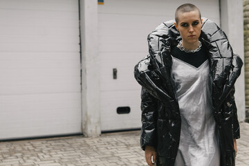 Portraits of a girl artist in stylish clothes and with short hair