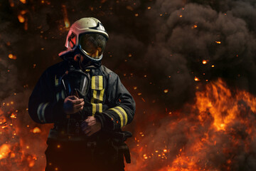 Professional firefighter dressed in special uniform with gas mask