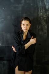Fototapeta premium portrait of a young woman in an emotional state of depression, stress, sadness, longing, loneliness, suffering