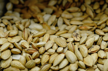 Background of dried pistachios. Sale of dried pistachios. Nuts. Healthy Eating.