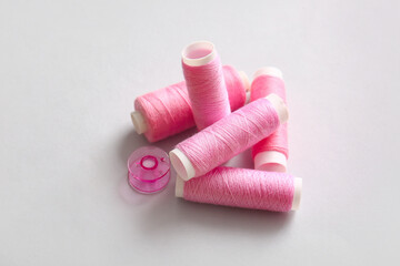 Thread spools on light background