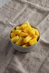 Organic Frozen Pineapple Slices in a Bowl, side view.