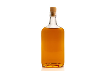 Bottle of whiskey or scotch whiskey or bourbon or brown rum isolated on white, copy space