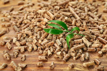 Wood pellets on wooden background