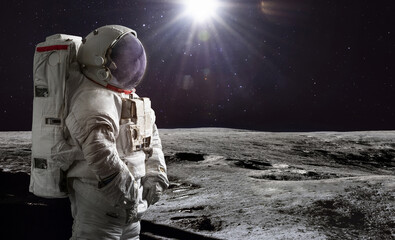 Astronaut on surface of Moon. Artemis lunar space program. Moonwalk of spaceman. Elements of this image furnished by NASA