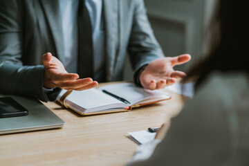 Asian male director is interviewing to recruit new employees