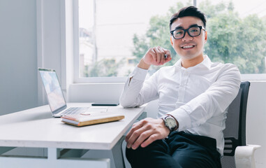 Young Asian businessman working at office