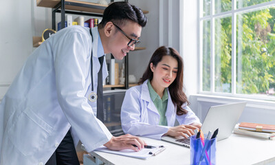 Fototapeta premium Two Asian doctors working together