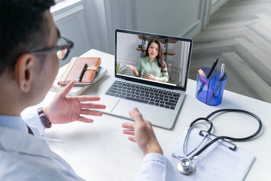 Asian doctors are telemedicine for patients via videocall, telehealth concept