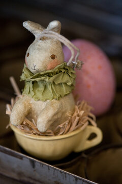 Easter Bunny decoration with egg -- &ndash; abstract, macro, close-up, image focus technique, full frame, antique, pastel, holiday background 
