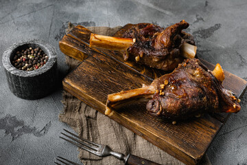 Slow Cooked Lamb Shanks meat, on gray stone table background