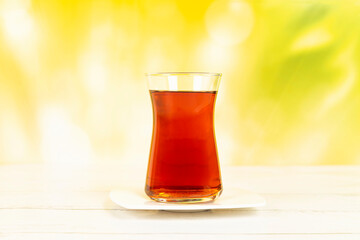 Turkish tea in a glass on the ground close-up