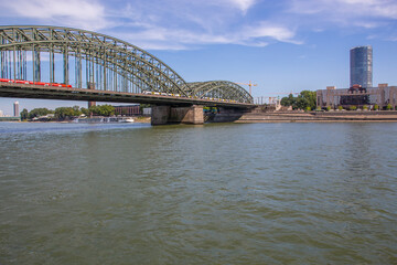 Naklejka premium The Rhine River and a Bridge of Cologne NRW Germany Europe
