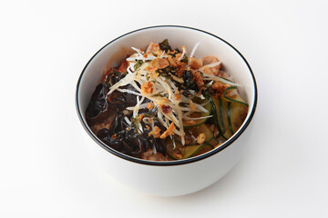 Poke bowl with eel. Hawaiian cuisine. Healthy food with Omega-3. A dish in a deep bowl.Healthy food. Lean menu. Isolated object. White background.Copy space.