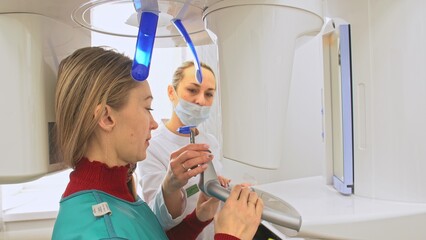 Doctor to take a image 3d scanner tomography of teeth and jaw in modern laboratory dental clinic....