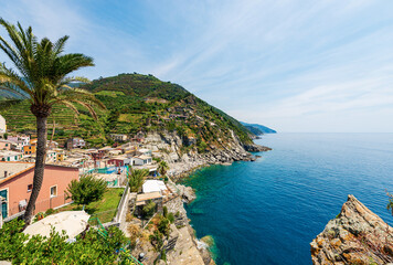 Panoramic view of the coast and Mediterranean sea in front of Vernazza village. Cinque Terre National park in Liguria, La Spezia province, Italy, Europe. UNESCO world heritage site.