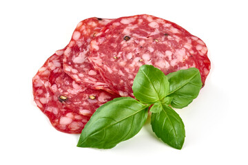 Italian Salami with basil leaves, isolated on white background.