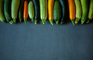 A set of multi-colored zucchini yellow, green, white, orange on the table close-up. Food...