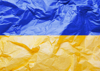 Symbol of Ukraine crumpled paper blue-yellow color. Patriotism.