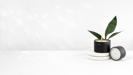 Soy wax candle in a black jar on a white background. natural eco friendly organic wax candles....