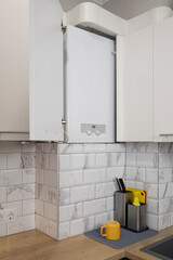 Gas boiler water heater installated in kitchen furniture