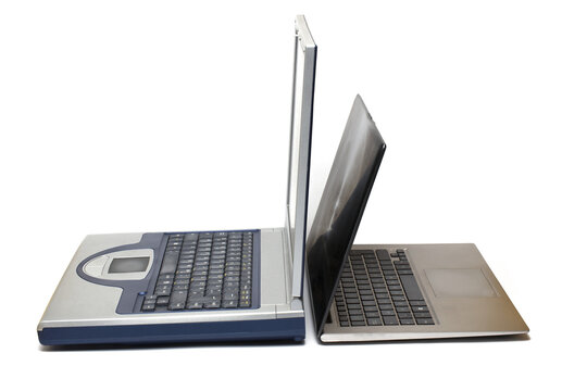 comparison generations old modern laptops white background