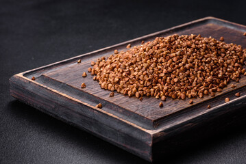 Bio buckwheat cereals raw food background, texture close up