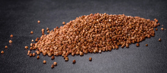 Bio buckwheat cereals raw food background, texture close up