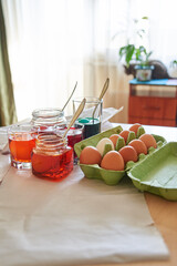 preparation for the Easter holiday, coloring eggs at home, tissue with spoons